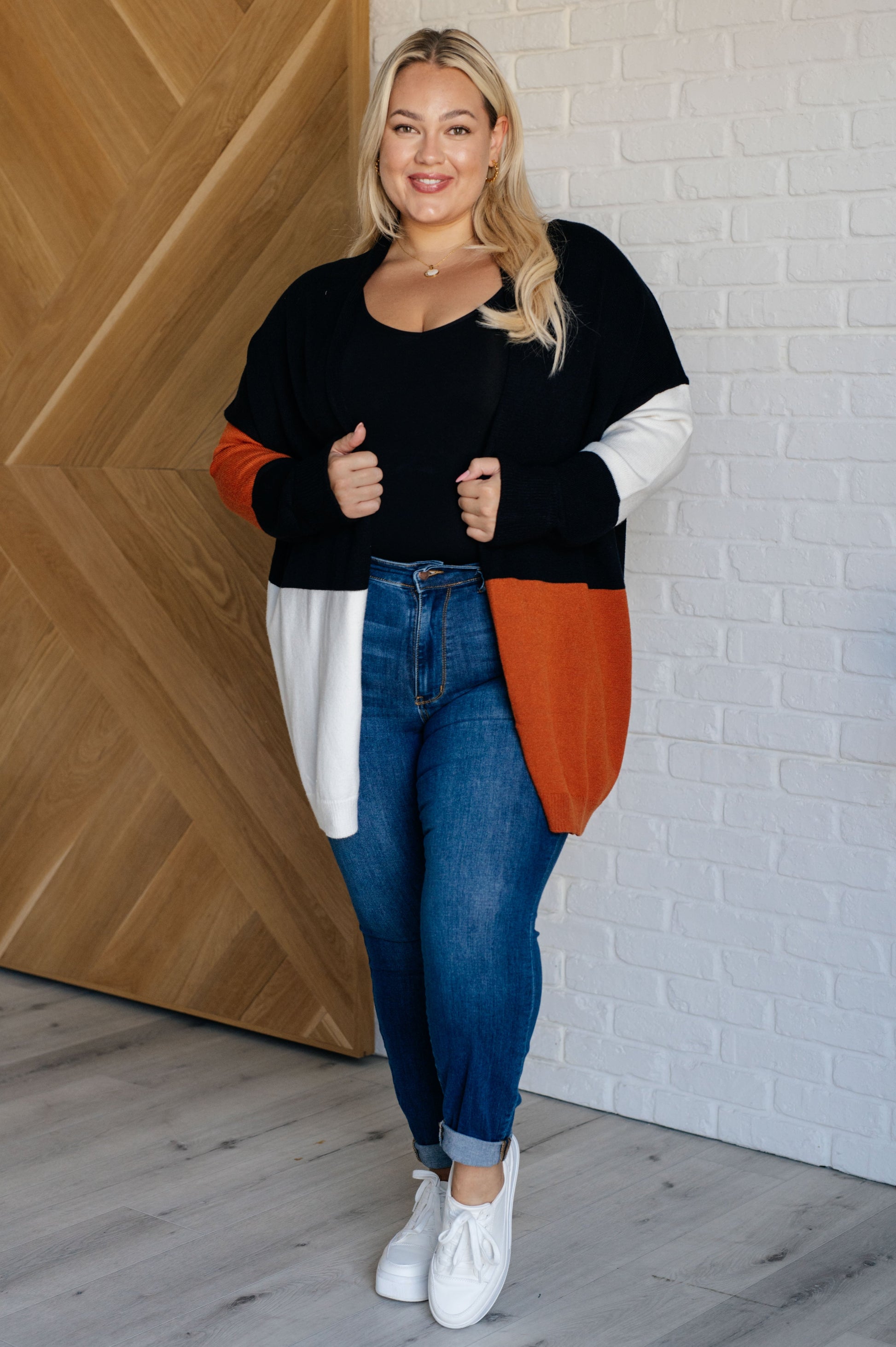 black, white, and rust long open front colorblock cardigan