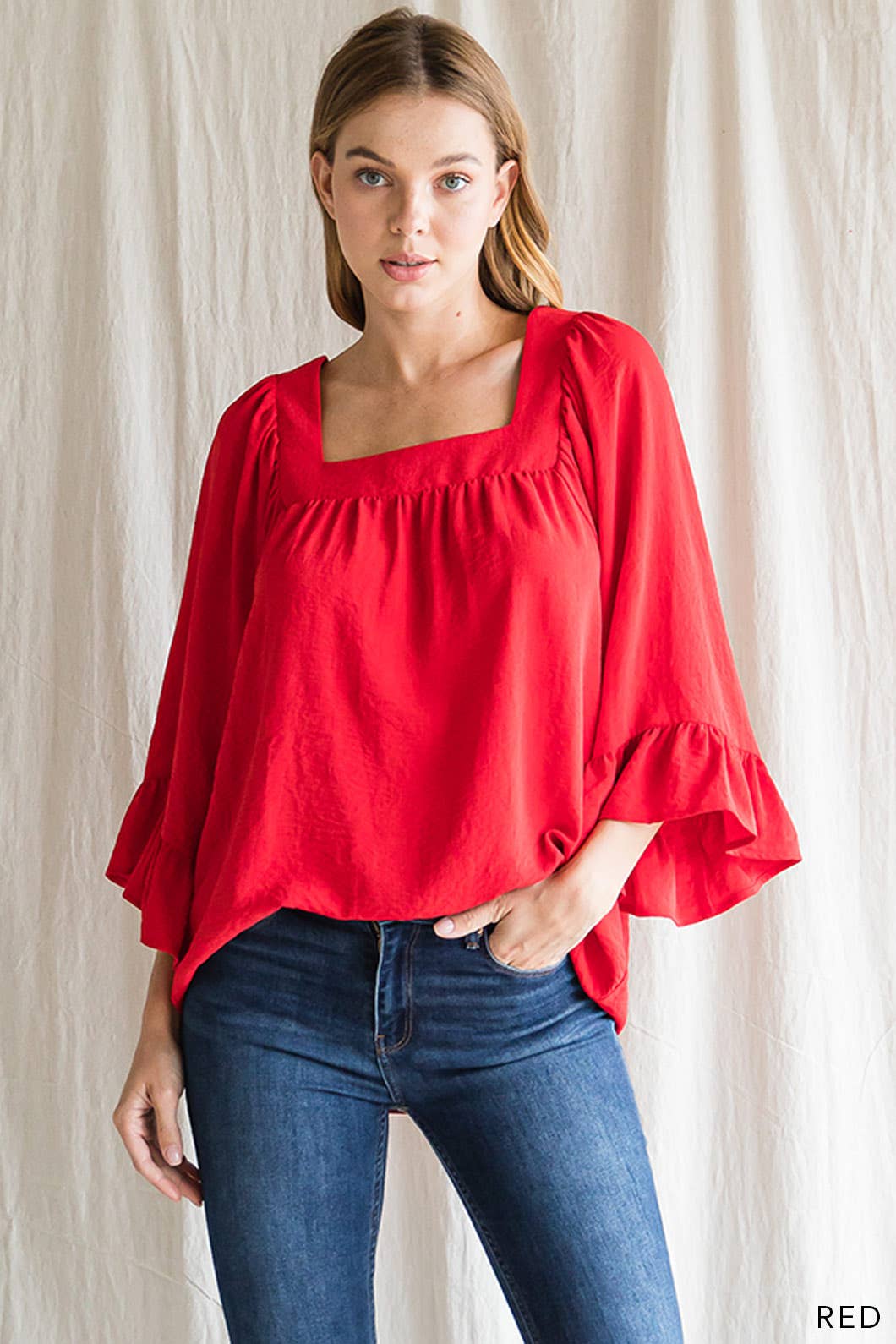 Women's red square neck top featuring 3/4 ruffle detail sleeve.
